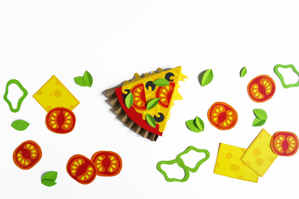 Pizza made of paper. Fast food. Hands of a child. Favorite hobby - Фото, изображение