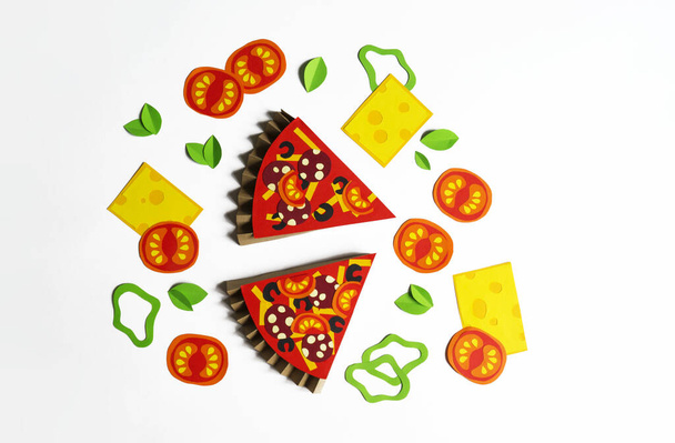 Pizza made of paper. Fast food. Hands of a child. Favorite hobby - Фото, зображення