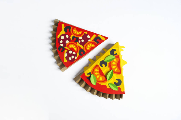 Pizza made of paper. Fast food. Hands of a child. Favorite hobby - Photo, Image