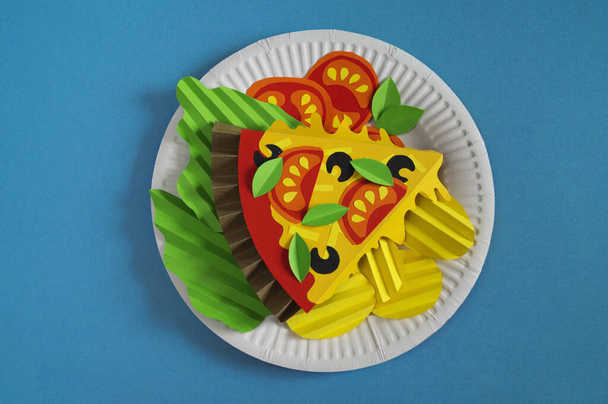 Pizza made of paper. Fast food. Hands of a child. Favorite hobby - Foto, Imagen