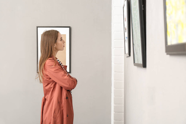 Young woman at exhibition in modern art gallery - Photo, Image