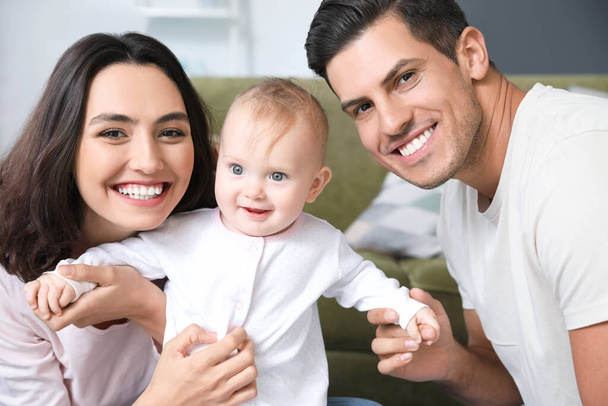 Cute baby with parents at home - Foto, Bild