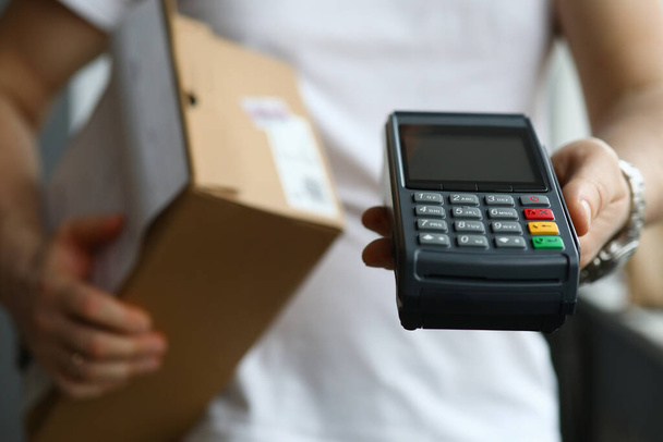 Man holds terminal app for payment and parcel - Photo, Image