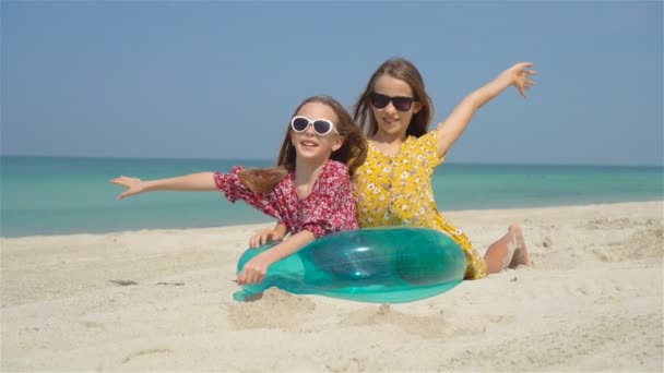 Adorable little girls during summer vacation have fun together - Materiał filmowy, wideo