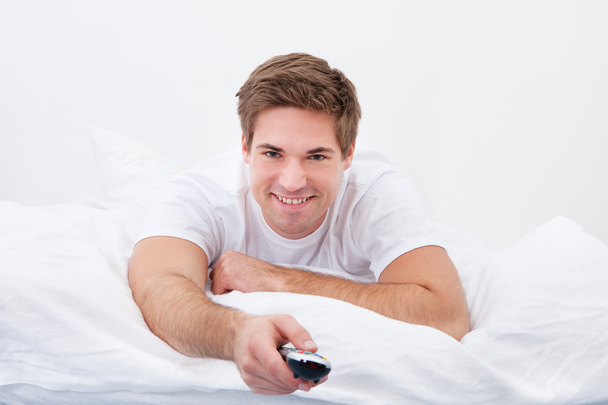 Young Man Holding Remote Control - Photo, Image