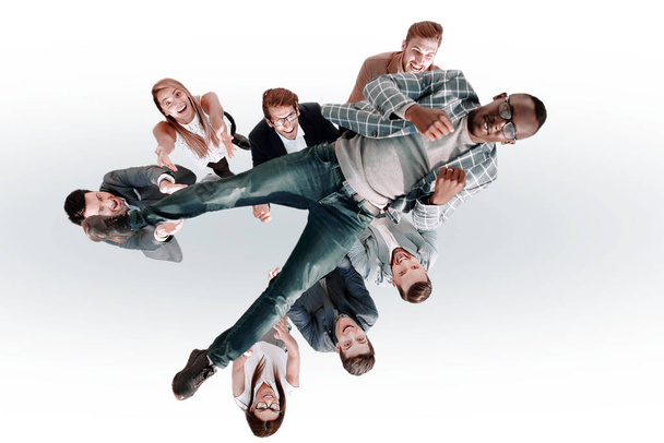 top view.business team throws up their leader - Foto, imagen