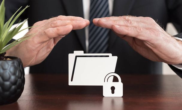 Data protection concept with businessman in a protective gesture - Fotoğraf, Görsel