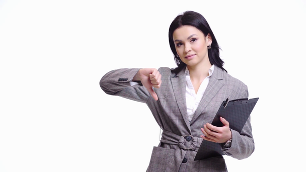 Businesswoman with thumb down holding clipboard isolated on white - Footage, Video