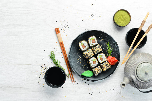 Sushi with fish, sesame and wasabi. Sea Sushi. Top view. - Фото, зображення
