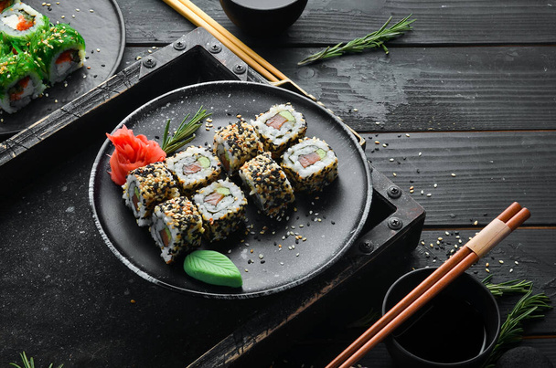Sushi with fish, sesame and wasabi. Sea Sushi. Top view. - Фото, изображение
