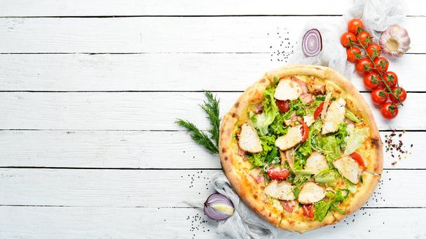 Pizza Caesar. Pizza with chicken, cheese and lettuce. Top view. Free space for your text. - Foto, imagen