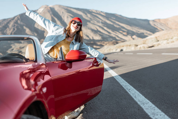 Carefree woman traveling by car - Photo, Image