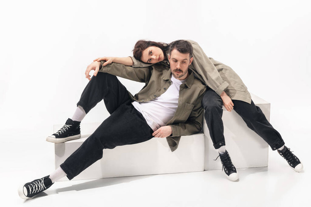 Trendy fashionable couple isolated on white studio background - Foto, immagini