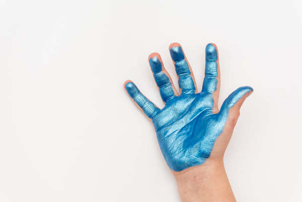 children's hands palms painted with paints, green, blue and purple on a white background - Φωτογραφία, εικόνα