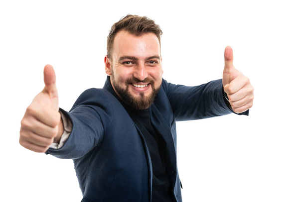 Business man wearing smart casual clothes showing double like gesture isolated on white background with copy space advertising area - Foto, immagini