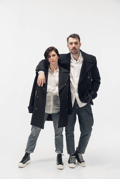 Trendy fashionable couple isolated on white studio background - Foto, imagen