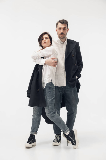 Trendy fashionable couple isolated on white studio background - Foto, Bild