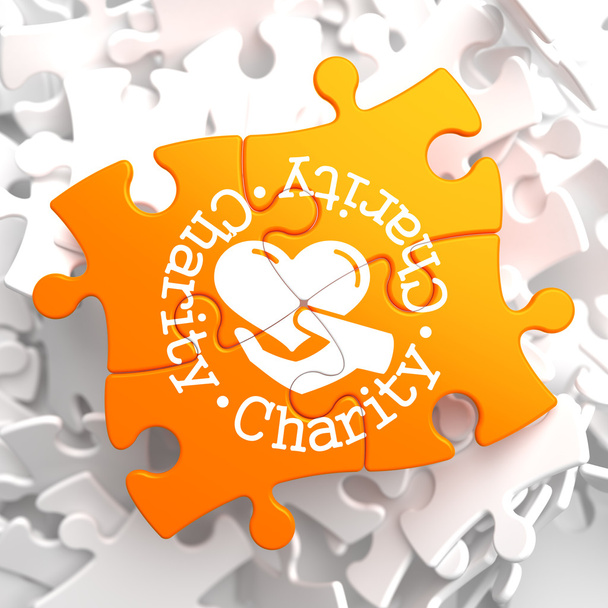 Charity-Konzept auf Orange Puzzle. - Foto, Bild