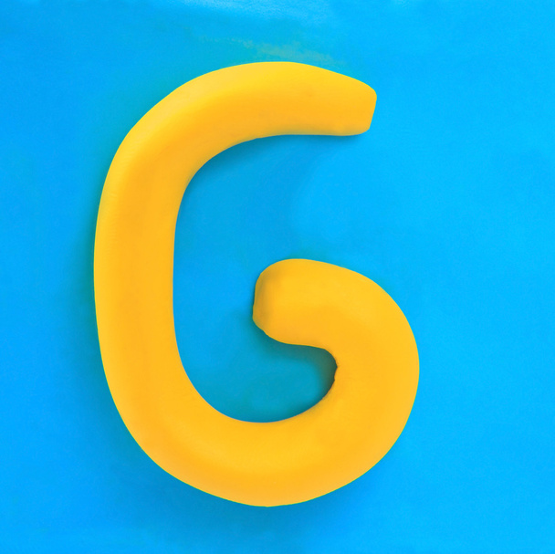 sárga agyag ábécé levél g - Fotó, kép