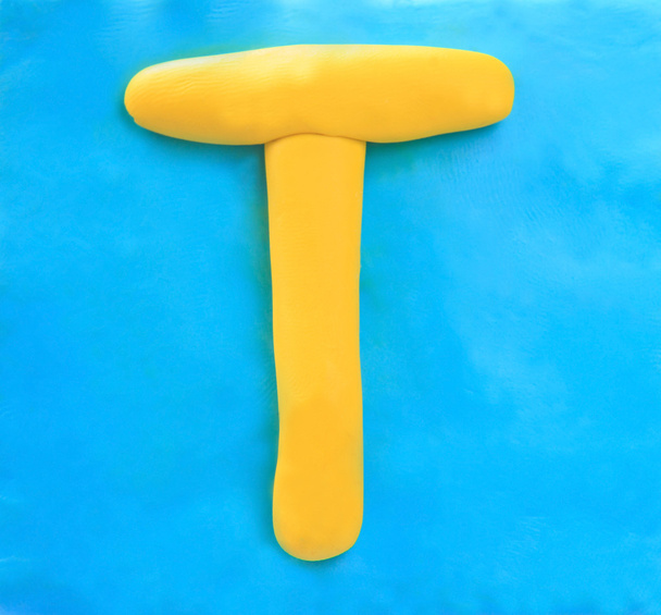 Yellow clay alphabet letter T - Photo, Image