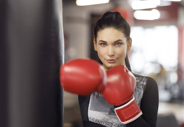 Personal defense class. Young female boxer in gym - Photo, Image