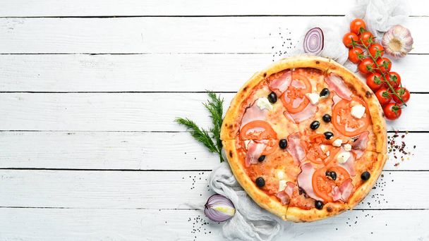 Italian pizza with tomatoes, bacon and olives. Top view. Free space for your text. - Foto, afbeelding