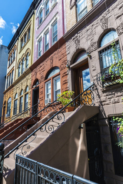 Old typical multicolor houses in the Harlem neighborhood in Manhattan, New York City, USA - Fotoğraf, Görsel