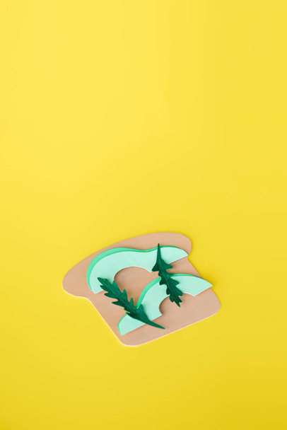 top view of paper avocado sandwich isolated on yellow with copy space  - Photo, Image