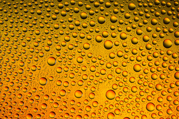 Капли воды спектральный градиент оранжево-желтого золота цвета солнца радуга красочные бусины lotuseffekt tau герметизации
 - Фото, изображение