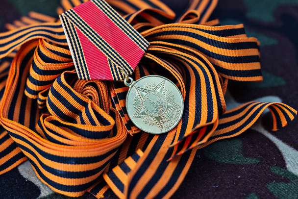 Military uniform, St. George ribbon closeup. Victory symbol - Fotó, kép