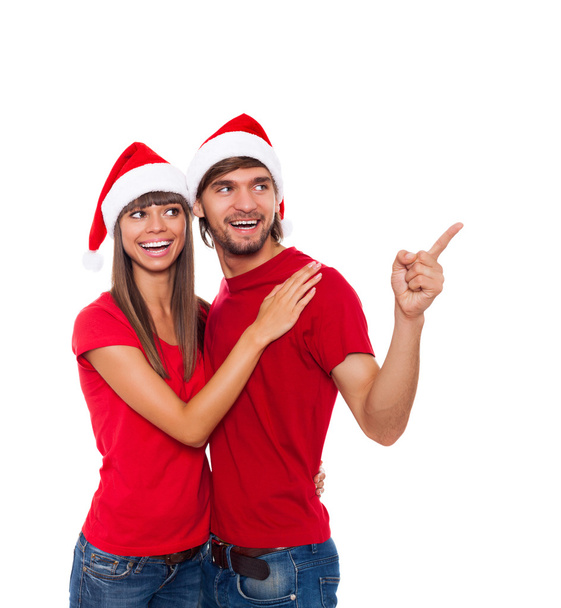 Christmas holiday couple point finger to empty copy space - Φωτογραφία, εικόνα