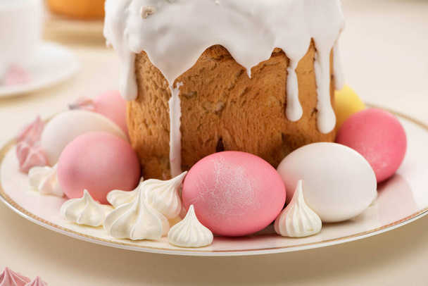 close up view of Easter cake with painted eggs and meringue on plate - Φωτογραφία, εικόνα