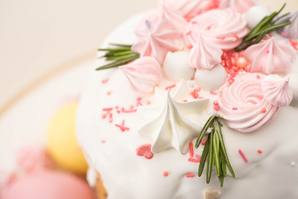 close up view of tasty Easter cake with rosemary and meringue on glaze - Photo, image