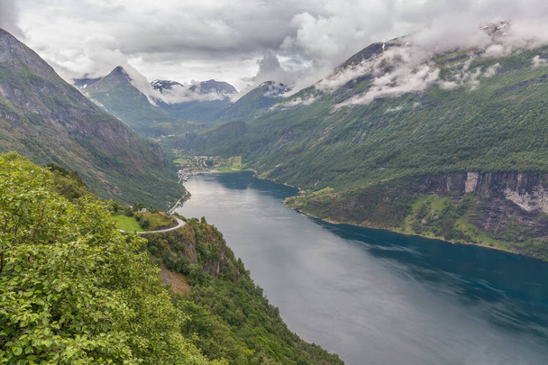 Geiranger fjord, Beautiful Nature Norway. It is a 15-kilometre, 9.3 mi long branch off of the Sunnylvsfjorden, which is a branch off of the Storfjorden. selective focus - Foto, afbeelding