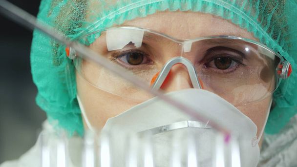 Close-up portrait of female researcher, working with lab equipment - Zdjęcie, obraz