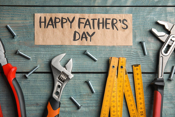 Flat lay composition with different tools on blue wooden background. Happy Father's Day - Photo, image