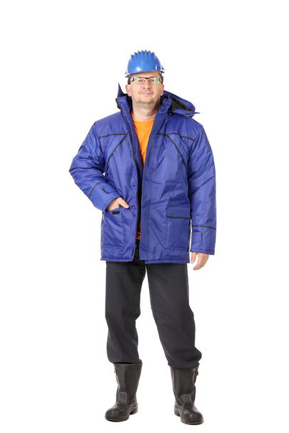 Hombre en ropa de trabajo de invierno y sombrero duro
 - Foto, imagen