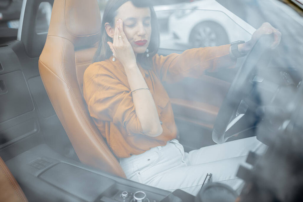 Woman feeling headache in the car - Foto, Bild