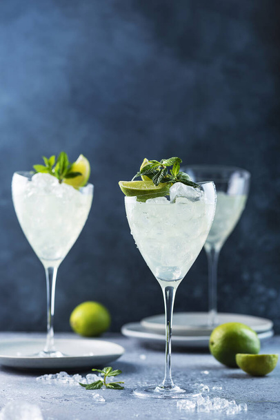 Summer cocktail mojito with rum, lime and mint, selective focus image - 写真・画像