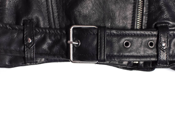 Close up details Black womens leather jacket top view. Fashionable modern trendy womens clothing. Vintage biker jacket. Black genuine leather texture - Photo, image