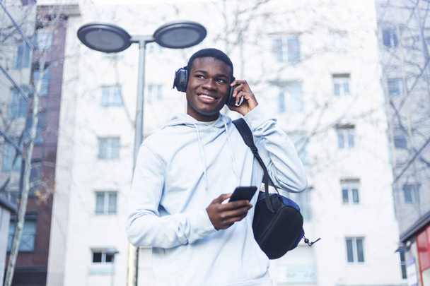African Young Man Listening Music. - Valokuva, kuva
