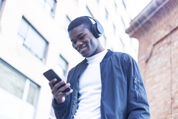 African Young Man Listening Music. - Fotó, kép