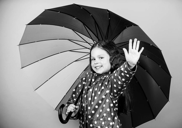 autumn fashion. rain protection. Rainbow. cheerful hipster child in positive mood. happy small girl with colorful umbrella. Small girl in raincoat. Carefree and so happy - Photo, Image