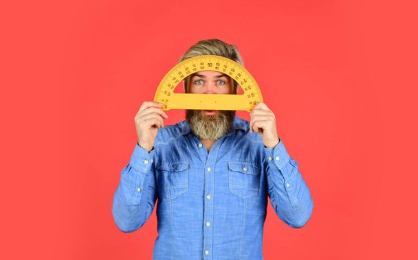 calculations. back to school. ready for engineering. tool for graphics. mature bearded man hold protractor ruler. study at home. education. school teacher use protractor. math and geometry subject - Foto, Imagen