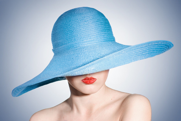 Attractive elegant woman in blue hat - Foto, Bild