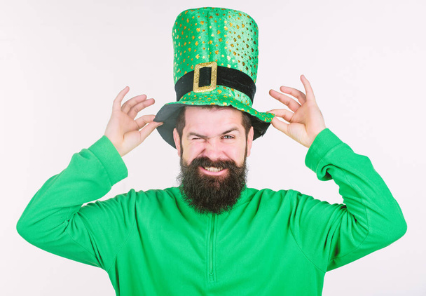 Green color part of celebration. Myth of leprechaun. Happy patricks day. Man bearded hipster wear green clothing and hat patricks day. Global celebration of irish culture. Saint patricks day holiday - Valokuva, kuva