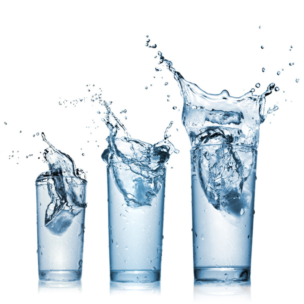 Water splash in glasses isolated on white - Φωτογραφία, εικόνα