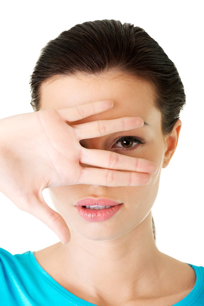 Mulher atraente cobrindo seu rosto com a mão
. - Foto, Imagem