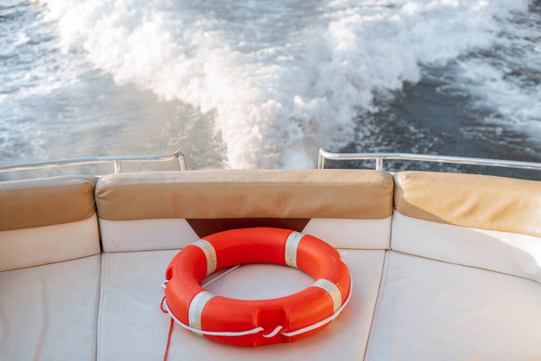 Red safety lifebuoy on the yacht - Photo, image