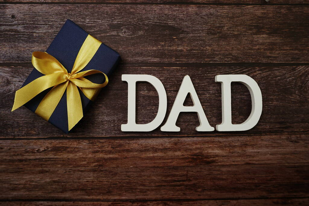 DAD alphabet letter on wooden background - Foto, immagini